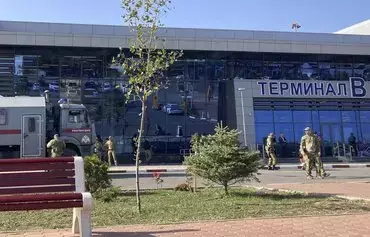 Law enforcement officers patrol an area outside the airport in Makhachkala, Russia, on October 30. Russian police on October 30 said they had arrested 60 people suspected of storming an airport in the Muslim-majority Caucasus republic of Dagestan, seeking to attack Jewish passengers coming from Israel. [AFP]