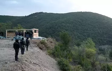 Georgian special police patrol the de facto Georgian-South Ossetian border at a checkpoint in the Kvemo Kartli region some 120km outside Tbilisi on August 30, 2019. [Vano Shlamov/AFP]