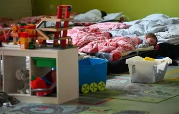 Ukrainian refugee children are pictured as they sleep in a kindergarten in the 7th district of Budapest, Hungary, on April 18. [Attila Kisbenedek/AFP]