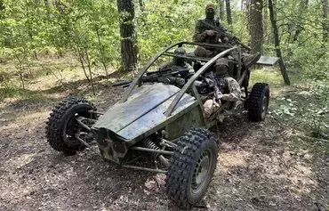 Ukrainian troops sit in a buggy created by entrepreneur Vladimir Sadyk. [Vladimir Sadyk personal archive]