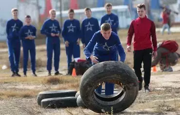 Schoolchildren attend training in the Russian-sponsored military-patriotic program 'School of Future Commanders' in Sevastopol, Russian-occupied Ukraine, on October 28. The training conducted under the guidance of military personnel includes disciplines such as multi-sport racing, tactical medicine and weapon handling. [AFP]