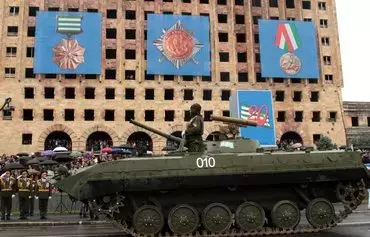 A Soviet-built infantry fighting vehicle, BMD-1, of the Abkhaz armed forces rolls during a military parade to mark the 20th anniversary of Abkhazia's de facto independence from Georgia, in Sukhumi on September 30, 2013. [Ibragim Chkadua/AFP]