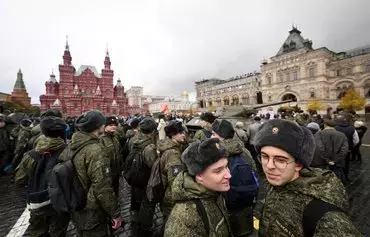 Military cadets visit an open air interactive museum on Red Square in Moscow on November 7. [Natalia Kolesnikova/AFP]