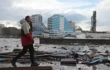 A picture shows damage at a storm-hit seafront in Crimea's largest city, Sevastopol, on November 27. [AFP]