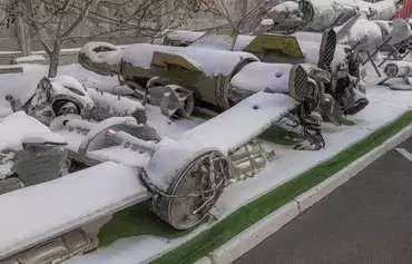 The wreckage of intercepted missiles launched at Ukraine, including Tochka-U and Kalibr missiles, is seen partly covered in snow in the courtyard of the Kyiv Scientific Research Institute of Forensic Expertise on January 16. [Roman Pilipey/AFP]