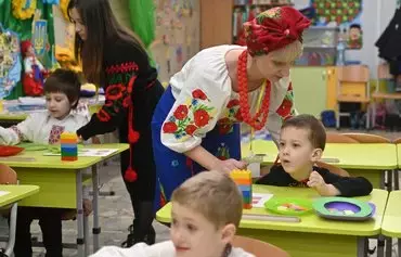 Children attend classes at an underground subway passage converted into a kindergarten, in Kharkiv on January 20, amid the Russian invasion of Ukraine. [Sergey Bobok/AFP]