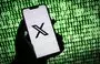 
This illustration photograph taken on October 30 shows the X (former Twitter) logo on a smartphone in France. [Sebastien Bozon/AFP]        