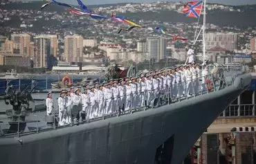 Sailors stand at attention on the deck of a Russian Black Sea Fleet warship during Navy Day celebrations in the port city of Novorossiysk, Russia, last July 30. [AFP]