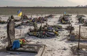 This photograph taken on January 23 shows graves, most of which are of the victims killed during the Russian strike last year on a shop and cafe in Groza village, at the cemetery in Groza, Kharkiv province, Ukraine. [Roman Pilipey/AFP]