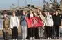 
Schoolchildren hold a flag of Young Army Cadets National Movement during training in the the military-patriotic program 'School of Future Commanders' in Sevastopol, Russian-occupied Ukraine, on October 28. The training conducted under the guidance of military personnel includes disciplines such as multi-sport racing, tactical medicine and weapon handling. [AFP]        