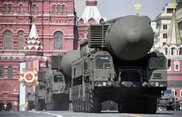 Troops drive Russian Topol-M intercontinental ballistic missiles through Red Square in Moscow on May 7, 2019, during a rehearsal for a Victory Day military parade. [Alexander Nemenov/AFP]