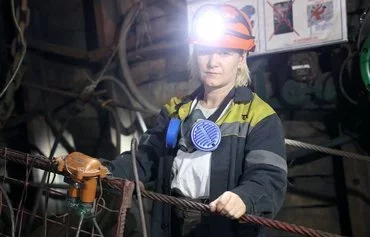 A conveyor belt operator, Tetiana Tarasova, 31, poses for a portrait at the mining area in one of the coal mines of DTEK Pavlogradvugillya, in Dnipropetrovsk province, on February 27 amid the Russian invasion of Ukraine. [Anatolii Stepanov/AFP]