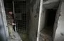 
A Ukrainian policeman January 31, 2023, walks in a basement of Kherson provincial police headquarters, allegedly used as a site for torturing pro-Ukrainian citizens during the Russian occupation. [Genya Savilov/AFP]        