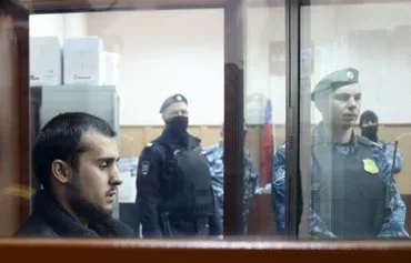 Dilovar Islomov, a suspected participant in the Crocus City Hall massacre, the deadliest attack in Europe to have been claimed by the 'Islamic State,' awaits his pre-trial detention hearing in Moscow on March 25. [Tatyana Makeyeva/AFP]