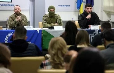 Three anti-Kremlin insurgents -- Oleksiy Baranovsky ('Lyutik') of the Freedom of Russia Legion, 'Holod' of the Siberian Battalion and RDK founder Denis 'White Rex' -- take part in a news conference on behalf of Russian insurgents fighting for Ukraine, in Kyiv March 21. [Anatolii Stepanov/AFP]