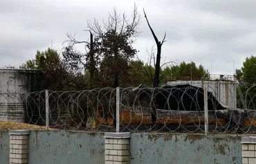 Burnt-out oil reservoirs are seen on the grounds of a fuel depot that was bombed during the Wagner Group mercenaries' rebellion in Voronezh, Russia, last June 27. The rebellion of a private army left scars far from the Ukrainian front in Russia's farming heartland. [AFP]