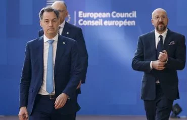 Belgian Prime Minister Alexander De Croo (left) and European Council President Charles Michel (right) arrive for a European Council summit at EU headquarters in Brussels on April 18. [Ludovic Marin/AFP]