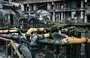 
Workers clean up debris in a turbine hall full of scorched equipment at a power plant of energy provider DTEK, destroyed after an attack, in an undisclosed location in Ukraine on April 19, amid the Russian invasion of Ukraine. [Genya Savilov/AFP]        