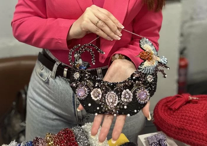 Iryna Pasechnik shows her handmade jewelry at the Proud to be Ukrainian festival April 20 in Zaporizhzhia. [Olha Chepil/Kontur]