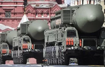 Russian Yars intercontinental ballistic missile launchers parade through Red Square during the Victory Day military parade in central Moscow on May 9, 2022. [Alexander Nemenov/AFP]