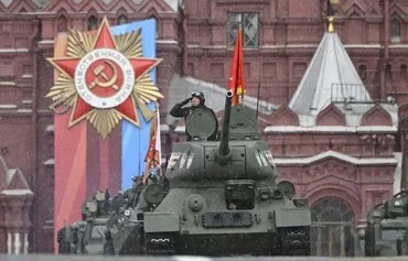 A lone Soviet era T-34 tank rolls on Red Square during the Victory Day parade in Moscow on May 9. [Alexander Nemenov/AFP]