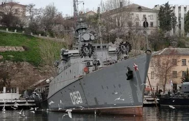 A Russian naval ship sits in port in Sevastopol, Crimea. [Filippo Monteforte/AFP]