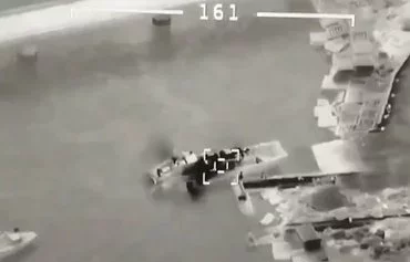 Screenshot from a video showing a Ukrainian Bayraktar drone destroying a Russian ship in the Black Sea. [Ukrainian Ministry of Defense]