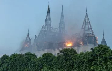 This photograph taken on April 29 in Odesa shows a burning building damaged by a missile attack amid the Russian invasion of Ukraine. [Oleksandr Gimanov/AFP]