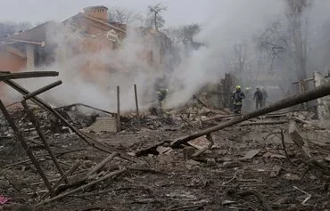 Ukrainian rescuers work at the site of a missile attack in Odesa on March 15. [Oleksandr Gimanov/AFP]