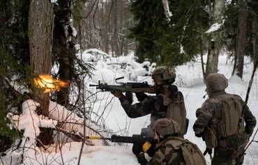 French soldiers take part in a major drill as part of NATO's EFP (Enhanced Forward Presence) at the Tapa Estonian army camp near Rakvere on February 6, 2022. [Alain Jocard/AFP]