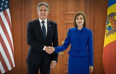 US Secretary of State Antony Blinken shakes hands with Moldova's President Maia Sandu following a joint press conference at the Moldovan Presidential Palace in Chisinau on May 29. [Elena Covalenco/AFP]