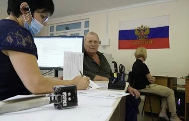 A man applies for a Russian passport in Melitopol, Zaporizhzhia province, in the Russian-occupied part of Ukraine August 3, 2022, amid Russia's invasion. [AFP]