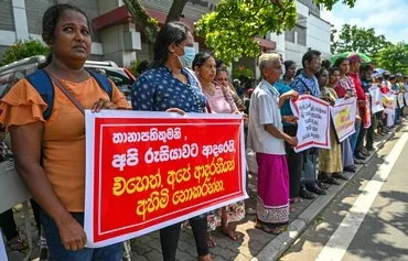 Protesters outside the Russian embassy in Colombo on June 4 demand the release of Sri Lankan veterans fighting for Russia and of prisoners of war in Ukraine. [Ishara S.Kodikara/AFP]