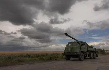 A French-made Caesar howitzer is seen June 16 moving through Donetsk province, amid the Russian invasion of Ukraine. [Roman Pilipey/AFP]