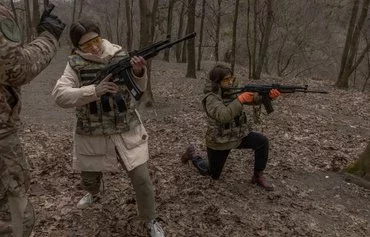 Ukrainian civilian women March 16 in Kyiv practice with weapons as they attend a training for women focused on the use of weapons and combat medical kit amid the Russian invasion of Ukraine. [Roman Pilipey/AFP]