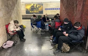 Schoolchildren shelter in a subway station during an air raid alarm in Kyiv on March 15. [Sergei Supinsky/AFP]