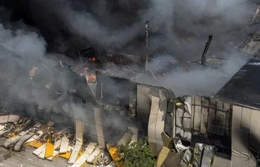 Firefighters extinguish a fire at the site of a Russian missile strike in Odesa on June 24 amid the Russian invasion of Ukraine. [Oleksandr Gimanov/AFP]