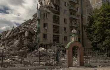 This photograph shows a destroyed residential building following shelling in the town of Toretsk on June 25. [Roman Pilipey/AFP]