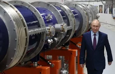 In a pool photograph distributed by Russia's Sputnik news agency, Russian President Vladimir Putin inspects the heavy-ion collider ring of the NICA (Nuclotron-based Ion Collider Faсility) complex in Dubna, Moscow province, June 13. [Alexander Kazakov/AFP]