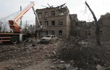 Employees of the State Emergency Service of Ukraine and medical staff evacuate medical equipment from a maternity hospital destroyed by a Russian missile attack in Selydove, Donetsk province, on February 16. [Anatolii Stepanov/AFP]