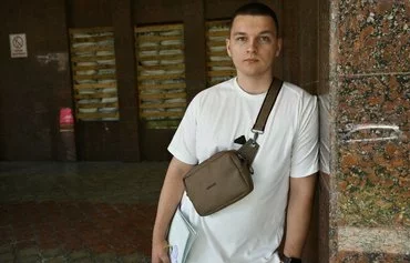 Graduate of Kyiv National Linguistic University Anton Yushyn, 21, poses during an AFP interview in Kyiv on June 28. [Genya Savilov/AFP]