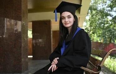 Graduate of Kyiv National Linguistic University Nikoletta Shova, 20, poses during an AFP interview in Kyiv on June 28. [Genya Savilov/AFP]