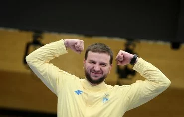 Silver medalist from Ukraine Serhiy Kulish poses during the award ceremony for the 50 Rifle 3 Positions men's final during the Paris 2024 Olympic Games August 1. [Alain Jocard/AFP]