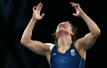 Ukraine's Iryna Koliadenko celebrates her win over Kyrgyzstan's Aisuluu Tynybekova in the women's freestyle 62kg wrestling semifinal at the Paris Olympics August 9. [Punit Paranjpe/AFP]