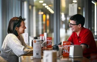 Arseny Blavatsky (right) talks to a girl during speed dating in Moscow on July 26. [Alexander Nemenov/AFP]