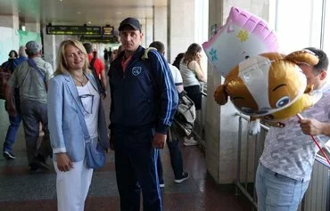 Hanna Skrypka (left), a lawyer for the organization Protection for Prisoners of Ukraine, stands next to Vitaliy Skorokhod, a former prisoner stranded in a Russian-occupied prison, whom she helped return to Ukraine, at the train station in Kyiv on June 22, amid the Russian invasion in Ukraine. [Anatolii Stepanov/AFP]