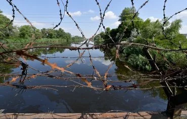 A view of a reactor cooling pond of the Russian-controlled ZNPP in Ukraine on June 15, 2023. [Olga Maltseva/AFP]