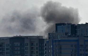 Smoke rises over buildings following a Russian drone attack in Kyiv on August 26. [Sergei Supinsky/AFP]