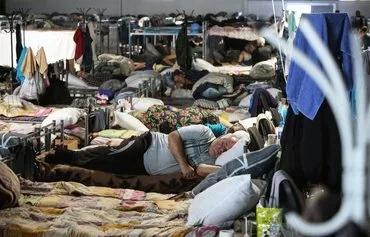 War-displaced inhabitants spend time in a center for displaced persons in Kursk province, Russia, on August 29 following Ukraine's cross-border offensive into the province. [Tatyana Makeyeva/AFP]