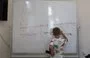 
The language barrier is among the challenges that Ukrainian children face in Polish schools and that deter them from wanting to attend school. A Ukrainian pupil takes part in a language class for Ukrainian children enrolled in Polish schools in Lublin on August 6. [Wojtek Radwanski/AFP]        